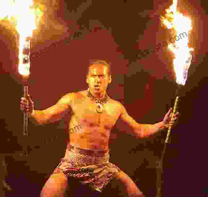 A Close Up Of A Fire Knife Dancer's Hands Deftly Twirling Flaming Knives The Fire Knife Dance: The Story Behind The Flames Ta Alolo To Nifo Oti