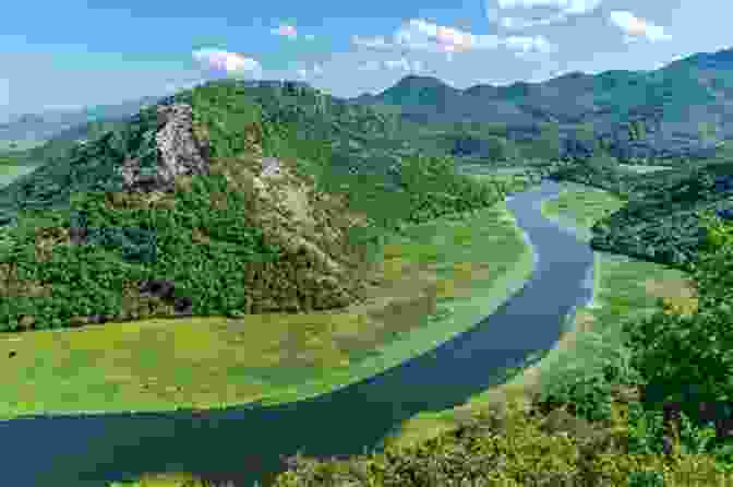 A Stunning Aerial Photograph Of A River Meandering Through A Lush Green Valley, Surrounded By Mountains In The Distance Watershed: Attending To Body And Earth In Distress
