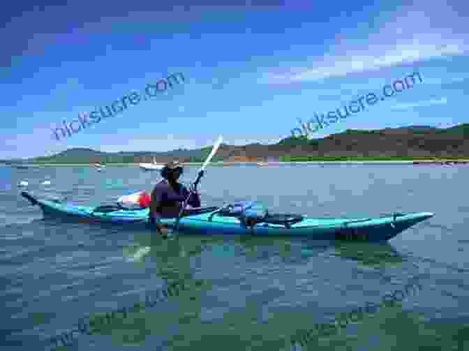 Kayakers Paddling Through The Calm Waters Of Lola's Coastline, Surrounded By Towering Cliffs My Name Is Lola (The West)